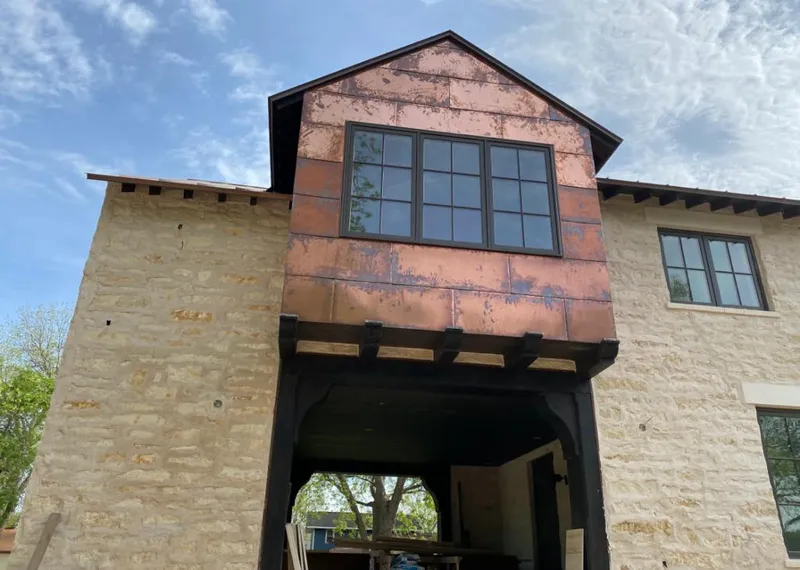 Copper metal panel facade on a stone building for Metal Roof Coating in Fort Mitchell