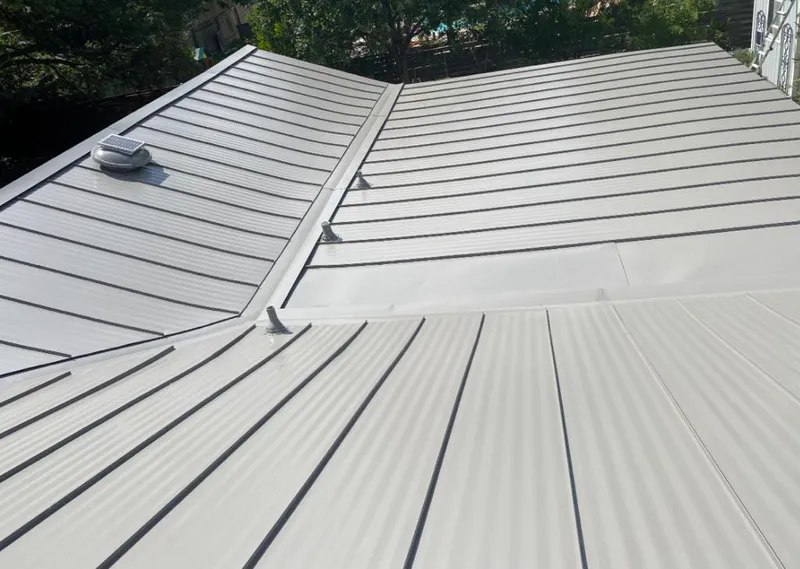 Solar attic fan installed on a metal roof for Roof Ventilation in Fort Mitchell
